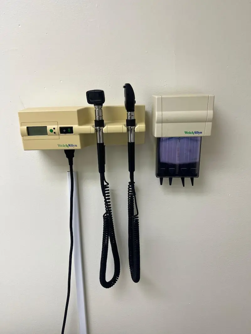 Wall-mounted otoscope and ophthalmoscope used for routine physical examinations