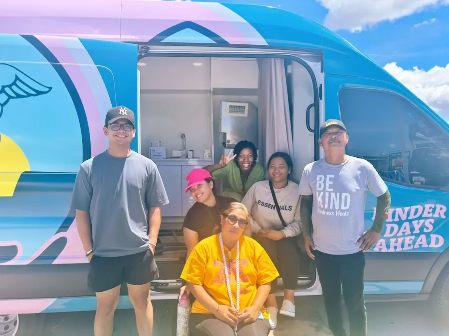 Todu Guam Foundation volunteers standing in front of the mobile care clinic in Hagåtña, Guam