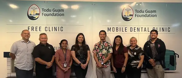 Todu Guam Foundation staff and partners standing together at a community health clinic