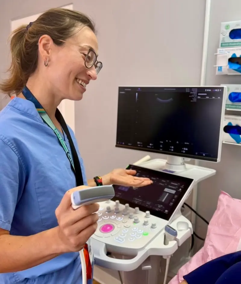 Healthcare professional demonstrating an ultrasound examination for women's health and prenatal care